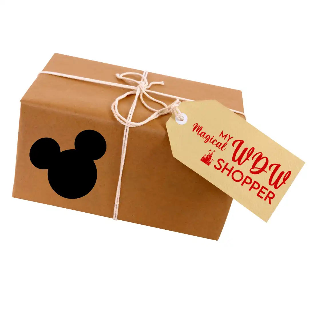 Brown paper package tied with twine and a Disney-themed gift tag.